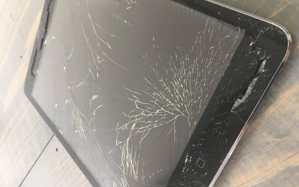 TechLord Technology technician repairing a cracked iPad screen at 299 Cameron Road, Tauranga
